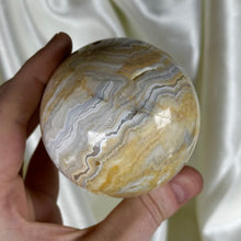 Load image into Gallery viewer, 13.9oz Banded Calcite & Agate “Creamsicle” Sphere (imperfect)