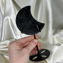 Load image into Gallery viewer, Arfvedsonite with Garnet Moon Carving on Stand B