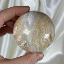Load image into Gallery viewer, 10oz Banded Calcite & Agate “Creamsicle” Sphere (imperfect)
