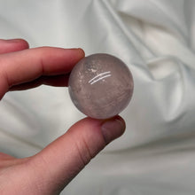 Load image into Gallery viewer, Icy Pink Mozambique Rose Quartz Sphere with strong Asterism