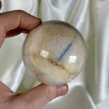 Load image into Gallery viewer, 10.7oz Banded Calcite & Agate “Creamsicle” Sphere (imperfect)