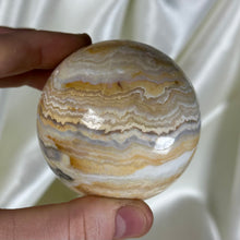 Load image into Gallery viewer, 10.4oz Banded Calcite & Agate “Creamsicle” Sphere