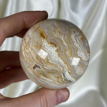 Load image into Gallery viewer, 10oz Banded Calcite & Agate “Creamsicle” Sphere (imperfect)