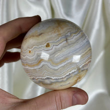 Load image into Gallery viewer, 12.8oz Banded Calcite & Agate “Creamsicle” Sphere (imperfect)