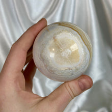 Load image into Gallery viewer, “Creamsicle” Banded Calcite Sphere