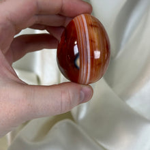 Load image into Gallery viewer, Striped Carnelian with Orca Agate Egg Carving