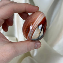 Load image into Gallery viewer, Striped Carnelian with Orca Agate Egg Carving