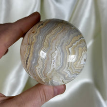 Load image into Gallery viewer, 10.7oz Banded Calcite & Agate “Creamsicle” Sphere (imperfect)