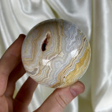 Load image into Gallery viewer, 13.9oz Banded Calcite & Agate “Creamsicle” Sphere (imperfect)