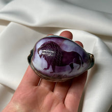 Load image into Gallery viewer, Purple Cowrie with Painted Leo Zodiac Design
