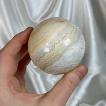 Load image into Gallery viewer, “Creamsicle” Banded Calcite Sphere
